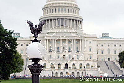 Lantern with an eagle and blurred view of the Capitol building from the back - image Stock Photo