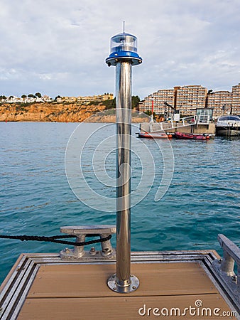 Lantern at the end of the yacht pier Stock Photo