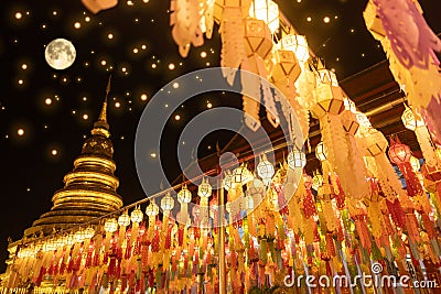 Lantern Festival in Lamphun people hang colorful light lanterns at Wat Phra That Hariphunchai Temple full moon Stock Photo