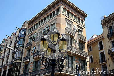 Lantern in front of the facade of one of the beautiful houses on La Rambla in Barcelona Editorial Stock Photo