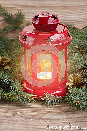 lantern with glowing candle and fir tree Stock Photo