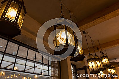 Lantern lamps hanging at restaurant Stock Photo