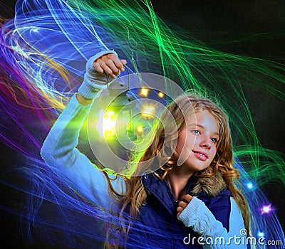 Lantern light in woman hand . Winter magic moving flames lines. Stock Photo