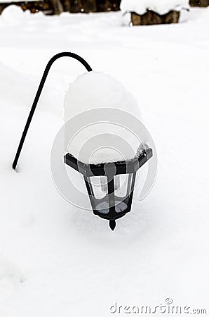 Lantern in the middle of the snow Stock Photo