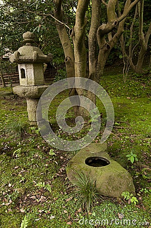 Lantern and rock pond in japaneese garden Sankei-en Stock Photo