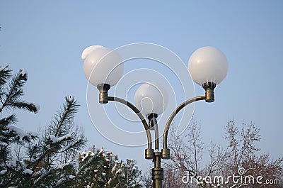 Lantern with three plafonds in winter against the sky Stock Photo