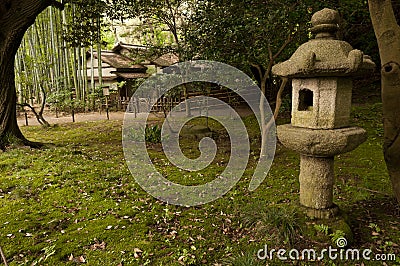 Lantern and traditional house in japaneese garden Sankei-en Stock Photo