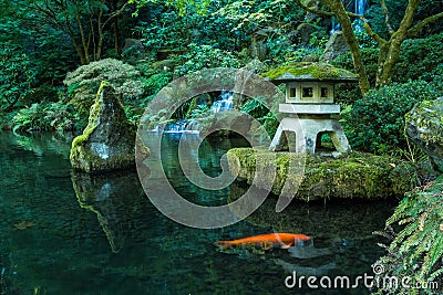 A Lantern and Waterfall in the Portland Japanese Garden Stock Photo