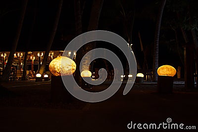 Lanterns on the way to calm night beach cafe Stock Photo