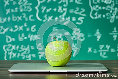 Laptop and apple on the desk Stock Photo