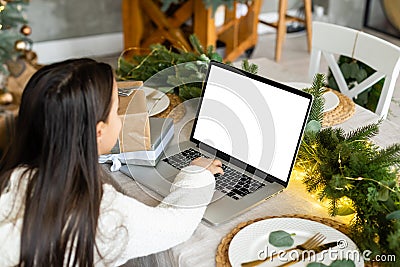 laptop blank screen, little girl at christmas Stock Photo