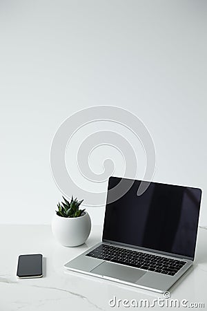 Laptop with blank screen, smartphone and Stock Photo