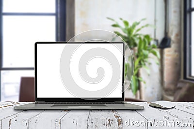 Laptop with blank screen on white table with mouse Stock Photo