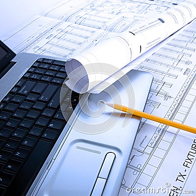 Laptop and blue prints Stock Photo