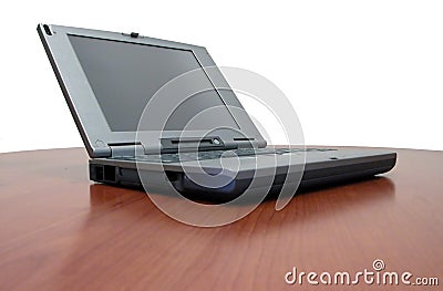 Laptop on cherry desk Stock Photo