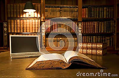 Laptop in classic library Stock Photo