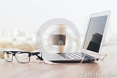 Laptop, coffee and glasses side Stock Photo