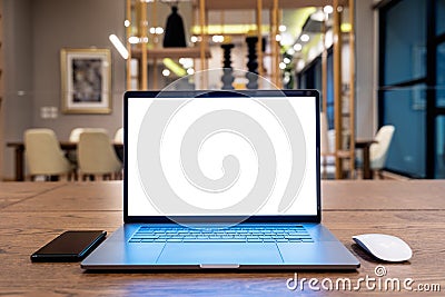 Laptop computer with blank white screen on table. Office concept Stock Photo