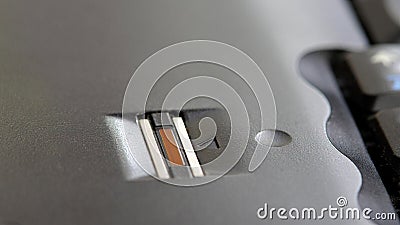 Laptop computer built-in fingerprint scanner sensor closeup detail view, nobody. In-built fingerprint biometry check, consumer Stock Photo