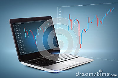 Laptop computer with forex chart on desktop Stock Photo