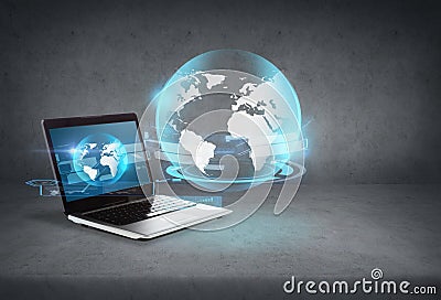 Laptop computer with globe hologram on screen Stock Photo