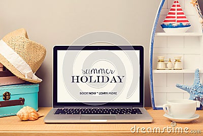 Laptop computer mock up template with beach items and home decor objects. Planning summer holiday vacation Stock Photo