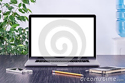 Laptop computer mockup with blank screen on office desk Stock Photo