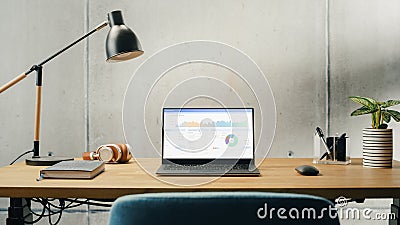 Laptop Computer with Software Platform Screen Display Standing on a Desk. Efficiently Minimalistic Stock Photo