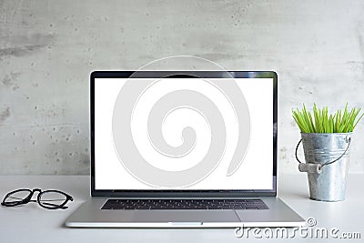 Laptop computer white screen on desk table front view Stock Photo