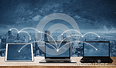 Laptop computers with network connection and sharing data to other devices. Internet networking and connection Stock Photo