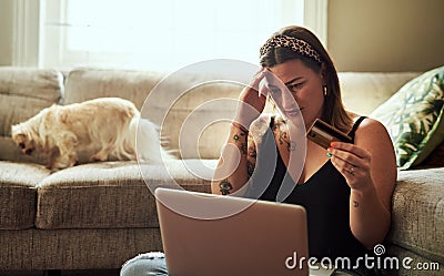 Laptop, credit card and woman headache, debt or confused for home loan, payment anxiety or fintech problem on floor Stock Photo