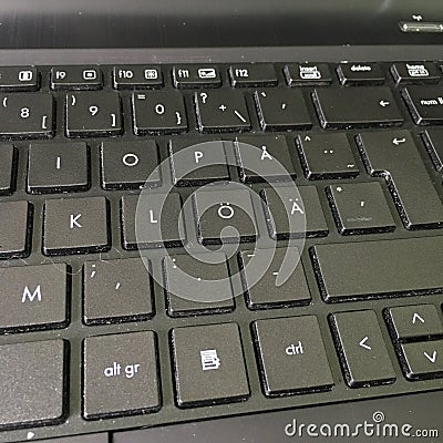 Laptop danish keyboard of computer running Windows 10 operating system, close-up macro keys Stock Photo