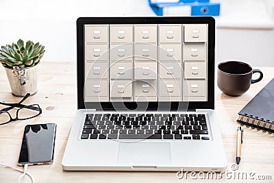 Laptop data storage. Filing cabinet on a computer screen Stock Photo