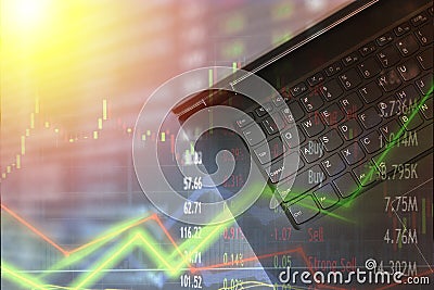 Laptop for finance use and stock trading with market charts overlay. Confusion and trade strategy unpredictable. Stock Photo