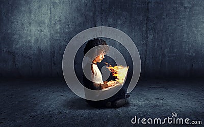 Laptop on fire Stock Photo