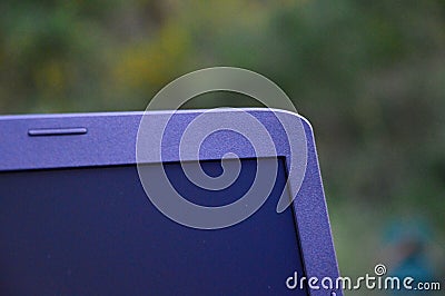 A laptop on the garden table Stock Photo