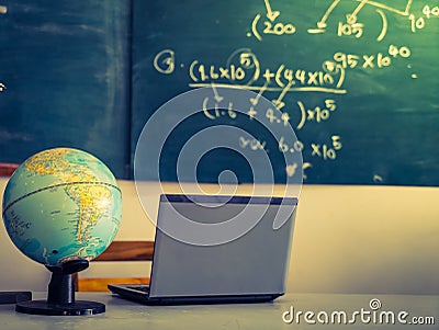 Laptop and globe on table ( Filtered image processed Stock Photo