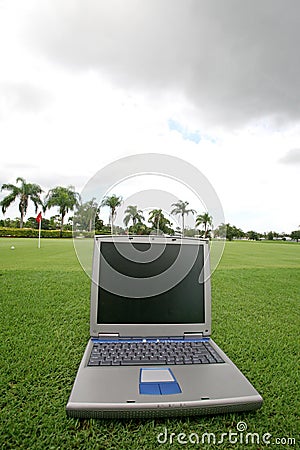 Laptop on a golf course Stock Photo