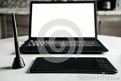 Laptop graphic tablet and pen. Designer`s workplace. Stock Photo