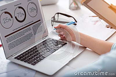 Laptop with graphics on a table Stock Photo