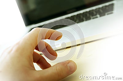 Laptop and Hand Stock Photo