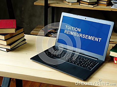 Laptop with information about Tuition Reimbursement. Stock Photo