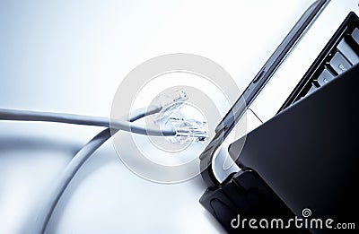 Laptop with internet cables Stock Photo