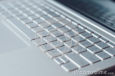 Laptop keyboard closeup. Silver netbook Stock Photo