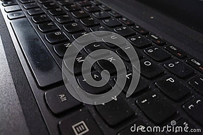 laptop keyboard that is getting faded because it& x27;s been used for a long time Stock Photo