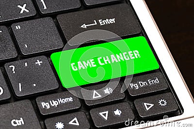 On the laptop keyboard the green button written GAME CHANGER Stock Photo