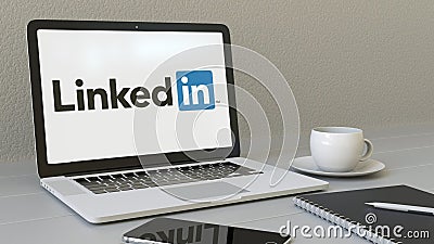 Laptop with LinkedIn logo on the screen. Modern workplace conceptual editorial 3D rendering Editorial Stock Photo