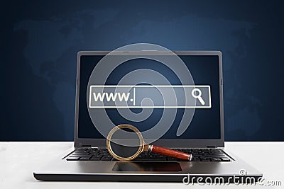 Laptop with magnifier and browser page Stock Photo