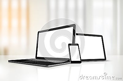 Laptop, mobile phone and digital tablet pc on office desk Stock Photo