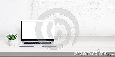 Laptop mockup on office desk with free space beside for promo text Stock Photo